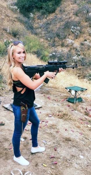 Awesome Girls Holding Big Guns – What Could Be Better?