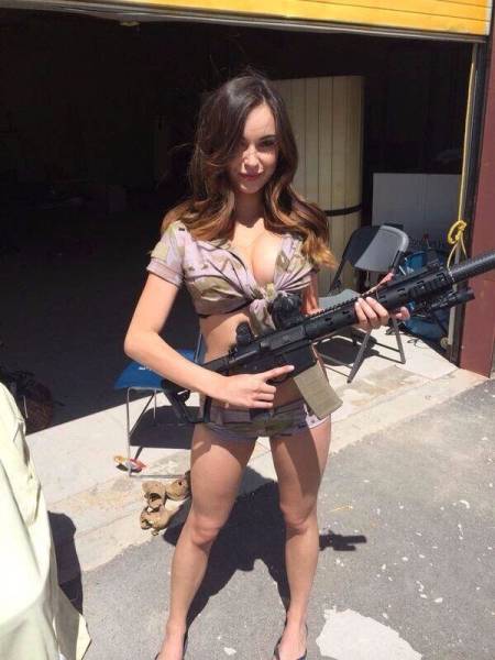 Awesome Girls Holding Big Guns – What Could Be Better?