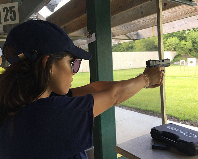 Awesome Girls Holding Big Guns – What Could Be Better?