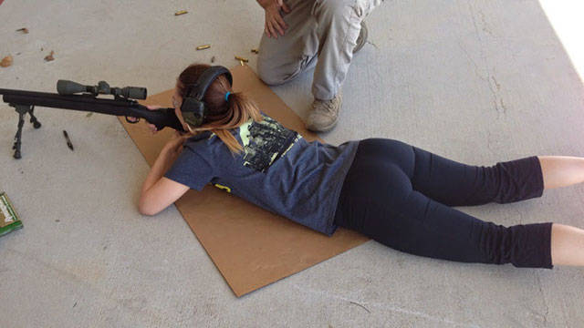 Awesome Girls Holding Big Guns – What Could Be Better?