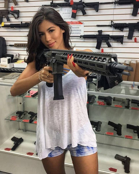 Awesome Girls Holding Big Guns – What Could Be Better?