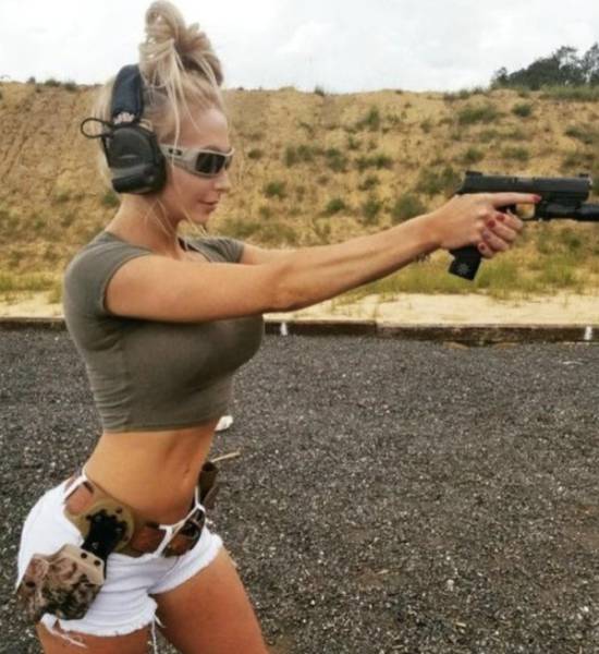 Awesome Girls Holding Big Guns – What Could Be Better?