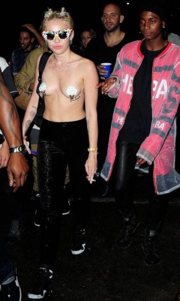 Miley Cyrus Parties Topless in Town