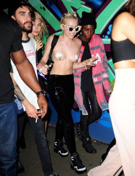 Miley Cyrus Parties Topless in Town