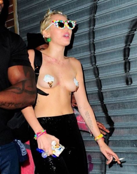 Miley Cyrus Parties Topless in Town