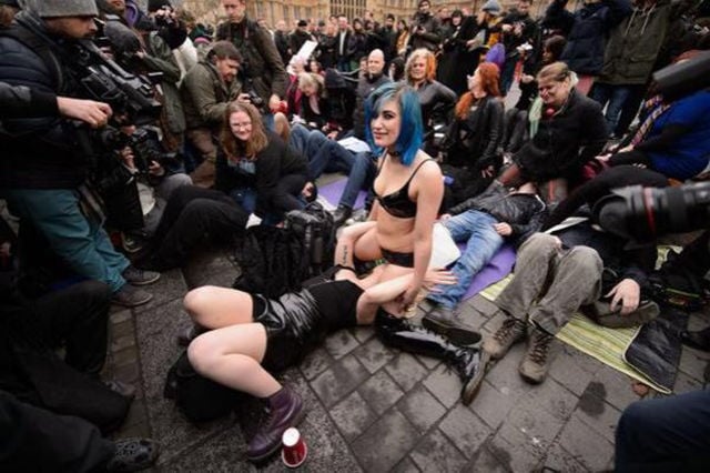A Bizarre Face Sitting Protest outside British Parliament